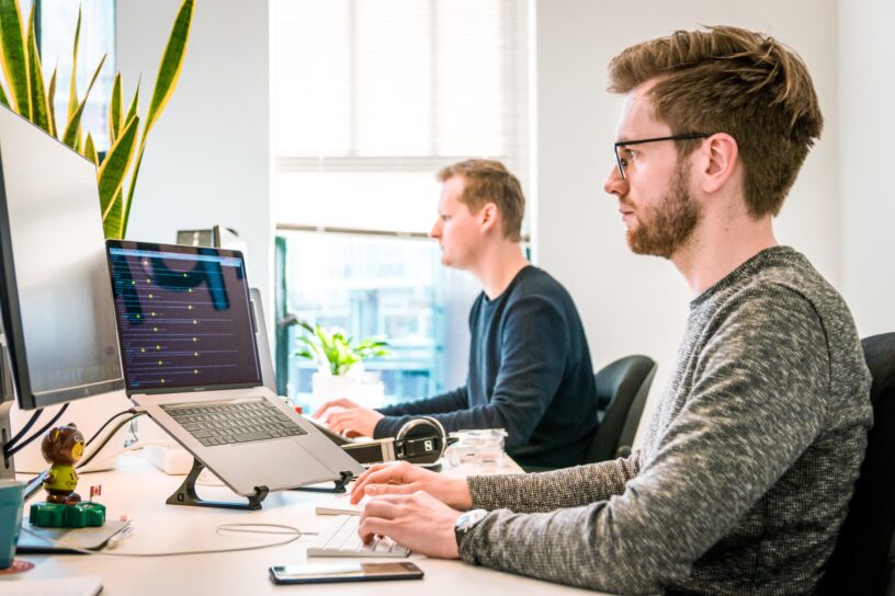 Two Developers working in their computers